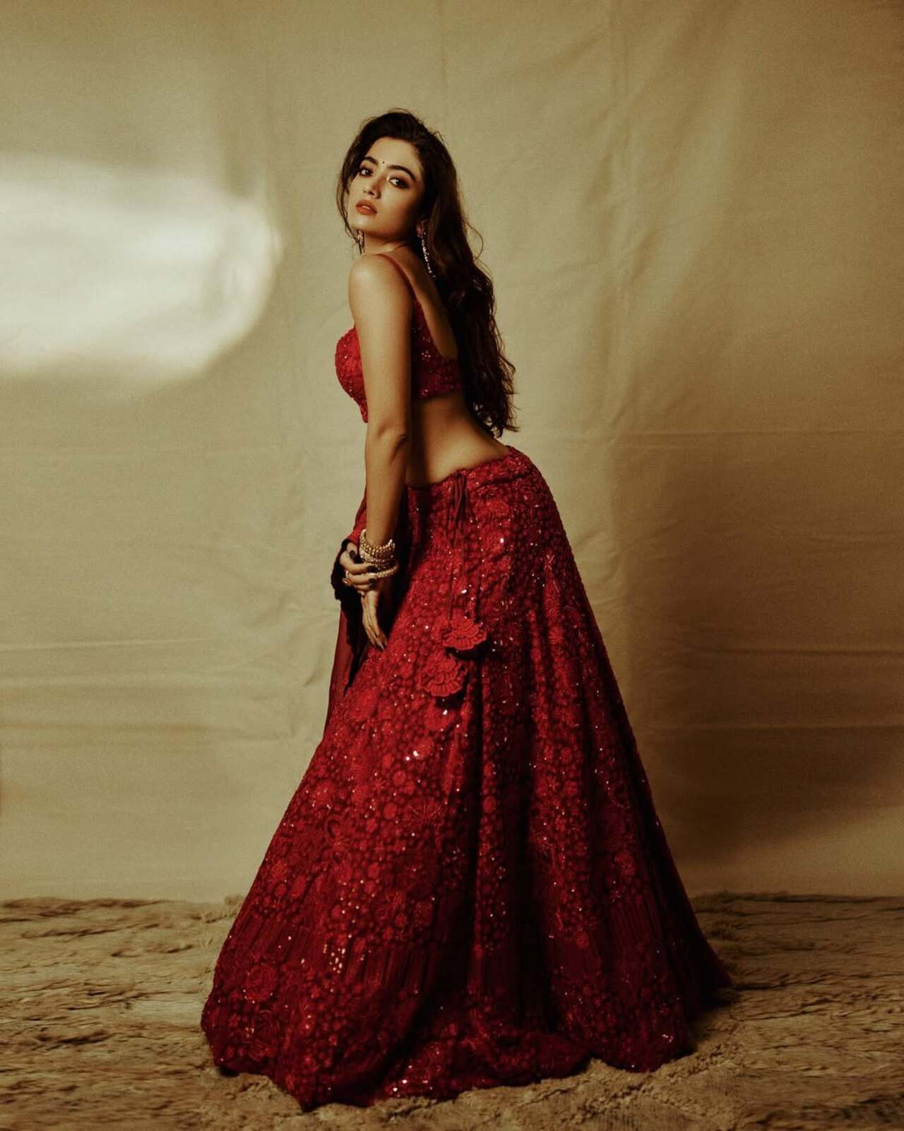  Her minimal accessories, flowing hair, and confident pose let the outfit shine, making it a perfect choice for grand festive nights or wedding celebrations. This look beautifully captures the essence of modern Indian fashion—fierce, festive, and unforgettable